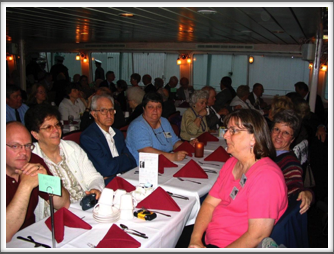 Dinner on the “Majestic” Riverboat:  Ellsworth Family - Bill and Elodie Caldwell, Reid Ellsworth, Janet Ellsworth, Diane Hill, Barbara Richins, Helen and Roy Chappell, other Kriegies and families