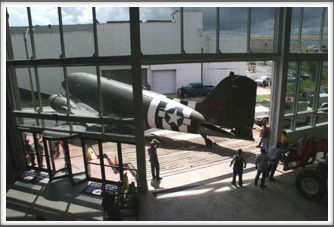 Post Reunion: C-47 Being Moved Through New Orleans Into D-Day Museum