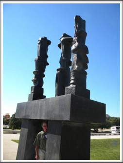 Pat Cochran Standing Under Sculpture at the Amon Carter Museum