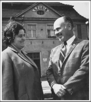 Amon Carter Jr. and Eugenia Grecka in front of the Szubin train station where she worked and shared war news with Amon by leaving messages in a wastebasket