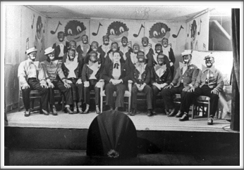 November ’43 - Glee Club, “The Robert E. Lee Minstrels”, Front Row l-r:  T. Cipriani, B. Fabian, T. Holt, K. Willis, H. Holder, C. Campbell, F. Maxwell, S. Thal, W. Sharpe. Second and Third Rows: Other members of the Glee Club