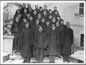 TEXANS - Front l-r:  Col. Doyle Yardley, Col. Charles Jones; 2nd row, 2nd from left behind the Kriegy with the mustache is John R. Rodgers; 2nd row, far right is Roy J. Chappell; 3rd row, 1st on left is Frank Aten; 2nd from left is Amon Carter; 3rd from left is Harry E. Evans; 4th row, 2nd from left is Leonard W. Spence